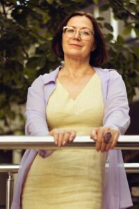 Mature woman with glasses outdoors dignified